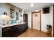Tastefully designed wine cellar with custom cabinets, granite counter, wood-paneled accents, and decorative lighting at 49 Waterside Se Dr, Cartersville, GA 30121