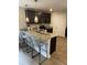 Beautiful kitchen featuring a granite countertop island with bar stool seating and pendant lights at 742 Great Oak Pl, Villa Rica, GA 30180