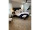This main bedroom features a large upholstered bed, ceiling fan, and modern furniture at 742 Great Oak Pl, Villa Rica, GA 30180