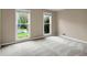 Comfortable bedroom with natural light, carpet, and neutral paint, offering a serene and restful atmosphere at 1197 Kenilworth Trce Trce, Snellville, GA 30078