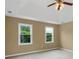 Neutral bedroom with ceiling fan, tray ceiling, and natural light, offering a calming and comfortable space at 1197 Kenilworth Trce Trce, Snellville, GA 30078