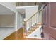Inviting entryway showcasing hardwood floors, staircase, and access to other rooms, creating a warm and welcoming ambiance at 1197 Kenilworth Trce Trce, Snellville, GA 30078