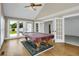 Game room offering ample natural light, hardwood flooring, and pool table at 1197 Kenilworth Trce Trce, Snellville, GA 30078