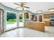 Inviting eat-in kitchen features tile floors, blue walls, and a bay window overlooking the backyard and pool at 1197 Kenilworth Trce Trce, Snellville, GA 30078