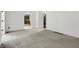 Open living area featuring wainscotting, neutral carpet and great natural lighting at 1197 Kenilworth Trce Trce, Snellville, GA 30078