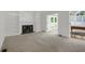 Bright living room featuring carpeted floor, fireplace and built-in bookshelves at 1197 Kenilworth Trce Trce, Snellville, GA 30078