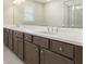 Bathroom vanity features a large mirror and double sinks with modern fixtures at 1247 Winterhaven Dr, Cumming, GA 30041