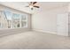 Bright bedroom featuring large windows and neutral carpeting at 1247 Winterhaven Dr, Cumming, GA 30041