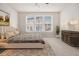 Serene bedroom featuring a comfortable bed, ample natural light, and contemporary furnishings at 1247 Winterhaven Dr, Cumming, GA 30041