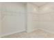 Walk-in closet offering ample storage with multiple shelving units at 1247 Winterhaven Dr, Cumming, GA 30041