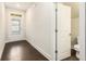 Inviting entryway with hardwood floors and access to a convenient powder room at 1247 Winterhaven Dr, Cumming, GA 30041
