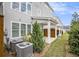 Exterior view of newly built homes with covered patios and well-maintained landscaping, showcasing the community's aesthetic appeal at 1247 Winterhaven Dr, Cumming, GA 30041
