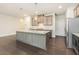 Beautiful kitchen with granite countertops, stainless steel appliances, and a center island at 1247 Winterhaven Dr, Cumming, GA 30041