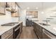 Modern kitchen featuring stainless appliances, granite counters, and a subway tile backsplash at 1247 Winterhaven Dr, Cumming, GA 30041