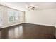Spacious living area with hardwood floors and ample natural light from large windows at 1247 Winterhaven Dr, Cumming, GA 30041