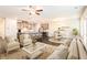 Bright, open-concept living space with hardwood floors, stylish furniture, and seamless flow to the kitchen at 1247 Winterhaven Dr, Cumming, GA 30041