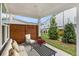 Cozy covered patio with outdoor seating and privacy screen, perfect for relaxing and entertaining at 1247 Winterhaven Dr, Cumming, GA 30041