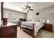 Cozy bedroom with a ceiling fan, a double bed, and furniture at 1445 Monroe Ne Dr # 14B, Atlanta, GA 30324