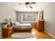 Bright bedroom showcasing gleaming hardwood floors and a large window for natural light at 1445 Monroe Ne Dr # 14B, Atlanta, GA 30324