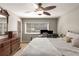 Neutral bedroom with hardwood furniture, a double bed, and a ceiling fan at 1445 Monroe Ne Dr # 14B, Atlanta, GA 30324