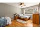 Bright bedroom showcasing gleaming hardwood floors and a large window for natural light at 1445 Monroe Ne Dr # 14B, Atlanta, GA 30324