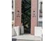 Close-up of multi-unit building entrance and outdoor staircase, with visible building numbers at 1445 Monroe Ne Dr # 14B, Atlanta, GA 30324