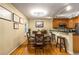 Cozy dining area featuring wood floors, a round table, and a breakfast bar with barstool seating at 1445 Monroe Ne Dr # 14B, Atlanta, GA 30324