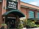 Exterior view of a Whole Foods Market with a brick facade, entrance canopy, and landscaping at 1445 Monroe Ne Dr # 14B, Atlanta, GA 30324