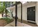 Charming front entrance with a covered porch and a secure-looking black door at 1445 Monroe Ne Dr # 14B, Atlanta, GA 30324