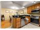 Well-lit kitchen featuring granite countertops, stainless steel appliances and tile flooring at 1445 Monroe Ne Dr # 14B, Atlanta, GA 30324