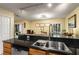 Spacious kitchen with dark countertops and stainless steel appliances, open to a dining area at 1445 Monroe Ne Dr # 14B, Atlanta, GA 30324