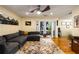 Inviting living room featuring hardwood floors, a ceiling fan, and a comfortable grey sectional sofa at 1445 Monroe Ne Dr # 14B, Atlanta, GA 30324