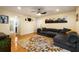 Spacious living room featuring a large sectional sofa, stylish decor, and hardwood floors at 1445 Monroe Ne Dr # 14B, Atlanta, GA 30324