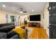 Comfortable living room with wood floors, a ceiling fan, and a mounted flat screen television at 1445 Monroe Ne Dr # 14B, Atlanta, GA 30324