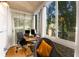 Sunroom offering views of backyard with a chair, desk and multiple windows at 1445 Monroe Ne Dr # 14B, Atlanta, GA 30324