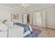 Primary bedroom features tray ceilings and sitting area with access to en-suite bathroom at 2165 Parkview Nw Run, Atlanta, GA 30318