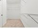 Walk-in closet with adjustable white wire shelving and neutral carpet at 2165 Parkview Nw Run, Atlanta, GA 30318
