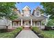 Charming two-story home featuring a welcoming front porch, well-maintained landscaping and neutral color palette at 2165 Parkview Nw Run, Atlanta, GA 30318