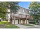 Back of home showing deck with covered garage spaces and two driveways at 2165 Parkview Nw Run, Atlanta, GA 30318