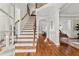 Elegant foyer with hardwood floors, staircase with iron railing, and access to formal living spaces at 2165 Parkview Nw Run, Atlanta, GA 30318