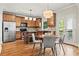 Eat-in kitchen with stainless steel appliances, wooden cabinets, and access to the deck at 2165 Parkview Nw Run, Atlanta, GA 30318