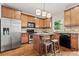 Kitchen featuring stainless steel appliances, custom cabinets, and a granite topped island at 2165 Parkview Nw Run, Atlanta, GA 30318
