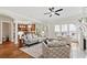 Open-concept living room with hardwood floors, a fireplace, neutral decor, and easy access to the kitchen at 2165 Parkview Nw Run, Atlanta, GA 30318