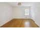 Cozy bedroom with hardwood floors, neutral paint, and a window offering natural light at 2855 Briarlake Ne Rd, Atlanta, GA 30345
