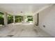 Spacious carport area showcasing white brickwork, supporting pillars, and an open view of the lush green backyard at 2855 Briarlake Ne Rd, Atlanta, GA 30345