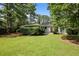 Charming single-story home surrounded by lush greenery, well-manicured lawn, and mature trees, creating a serene setting at 2855 Briarlake Ne Rd, Atlanta, GA 30345