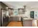 Well-equipped kitchen featuring stainless steel appliances and stylish gray cabinetry at 2855 Briarlake Ne Rd, Atlanta, GA 30345