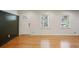 Bright living room featuring hardwood floors and a paneled accent wall at 2855 Briarlake Ne Rd, Atlanta, GA 30345