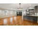 Bright, open living room with hardwood floors and modern lighting, next to a well-equipped kitchen at 2855 Briarlake Ne Rd, Atlanta, GA 30345