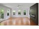 Spacious living room with hardwood floors, modern fireplace and large windows at 2855 Briarlake Ne Rd, Atlanta, GA 30345